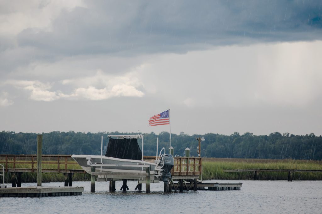 Center Console Curtain installed on a boat that is on a lift