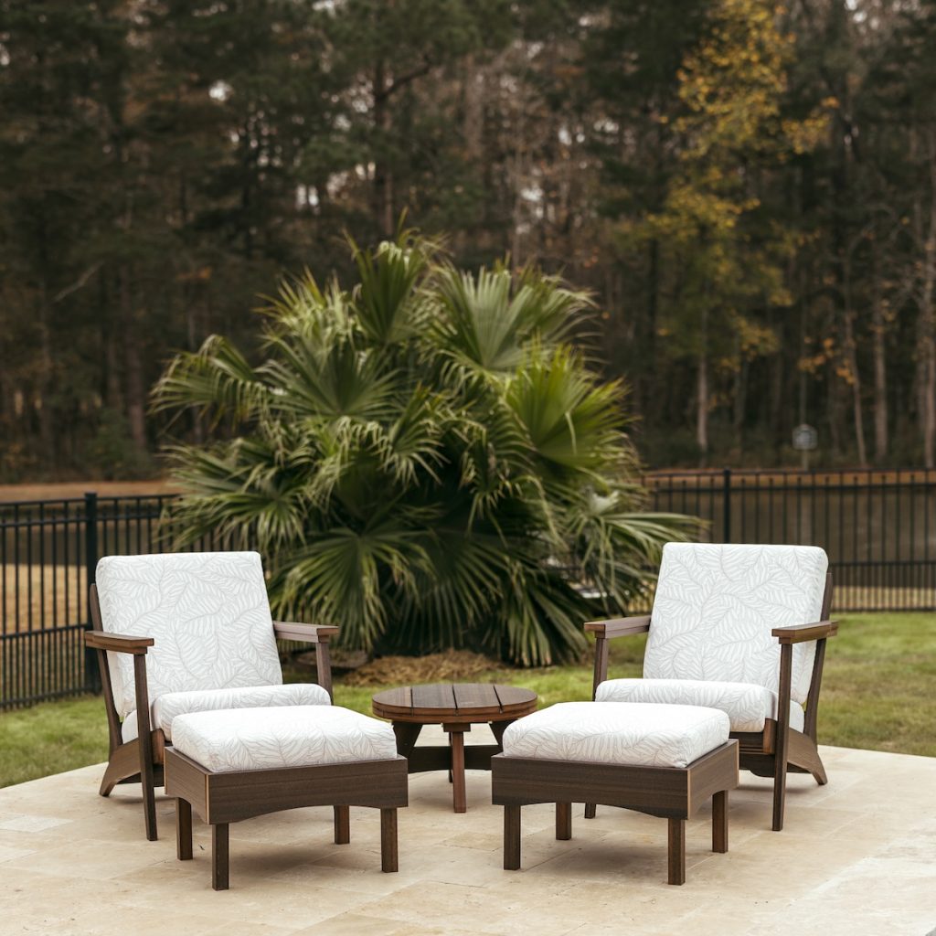 Coastal outdoor furniture with Sunbrella cushions and durable poly lumber seating.